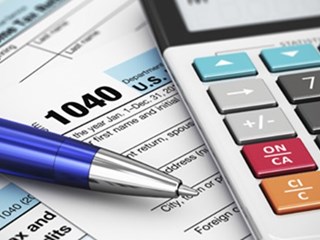 close up of pen and calculator
