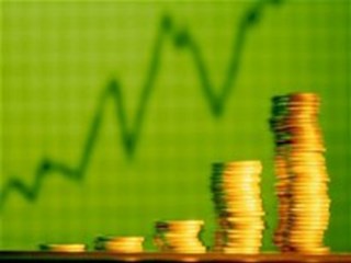 stacks of gold coins against green background