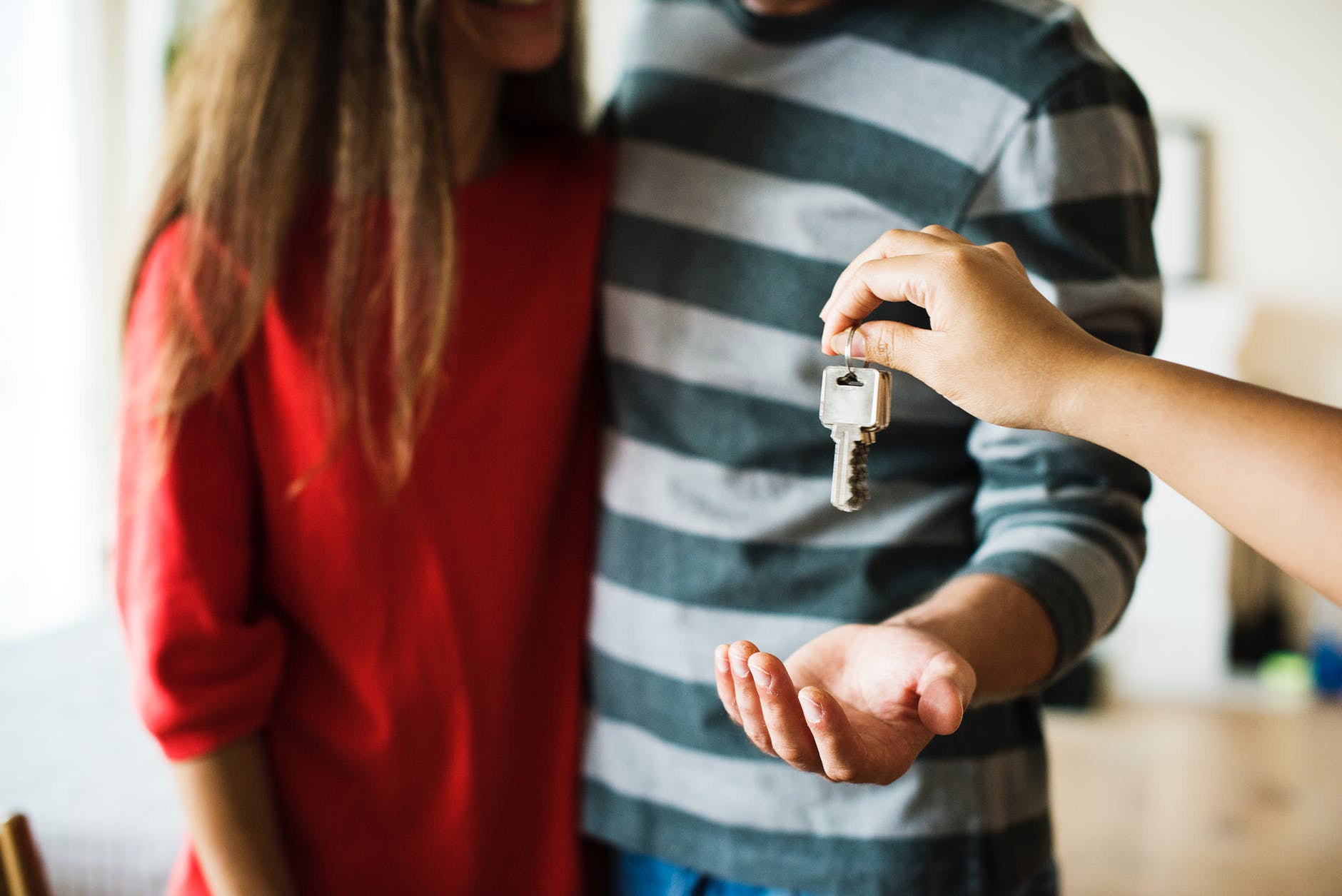 young couple receiving house keys