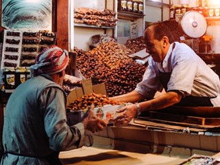 man handing box of food to customer