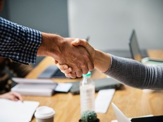 hand shake in business meeting