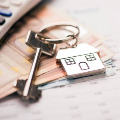 a key with a house key ring