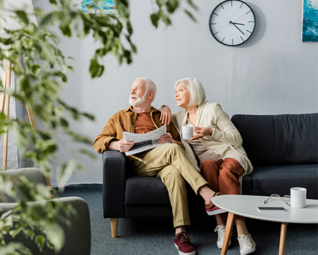 Couple sat on sofa