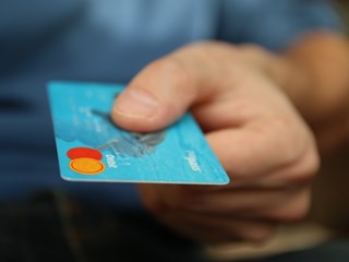 man holding bank card