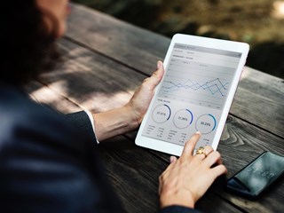 business woman looking at a tablet