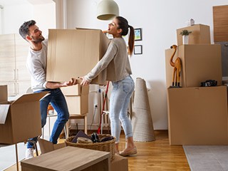 couple holding a box