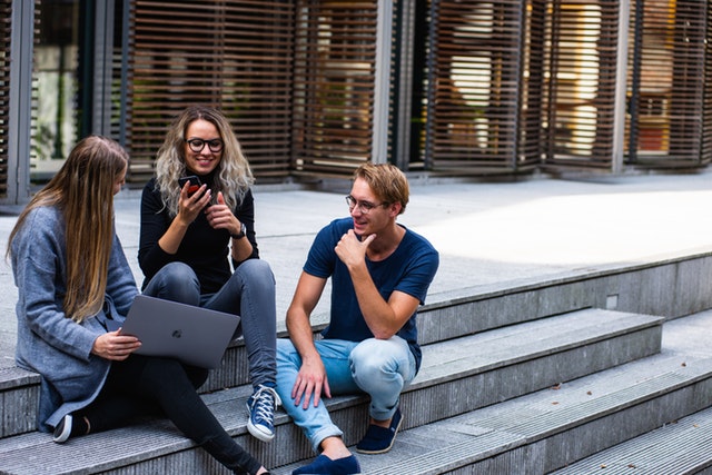 young adults meeting on some steps