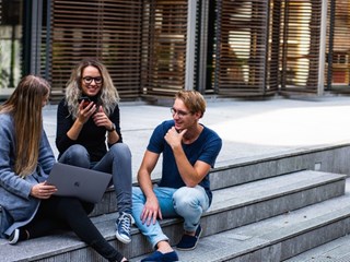 young adults meeting on some steps