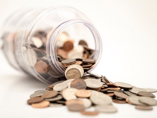 Savings falling out of a jar