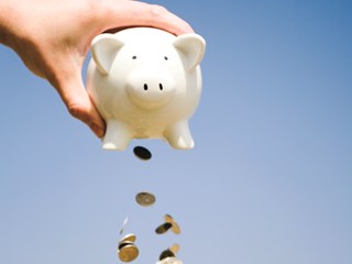 coins falling out of a piggy bank