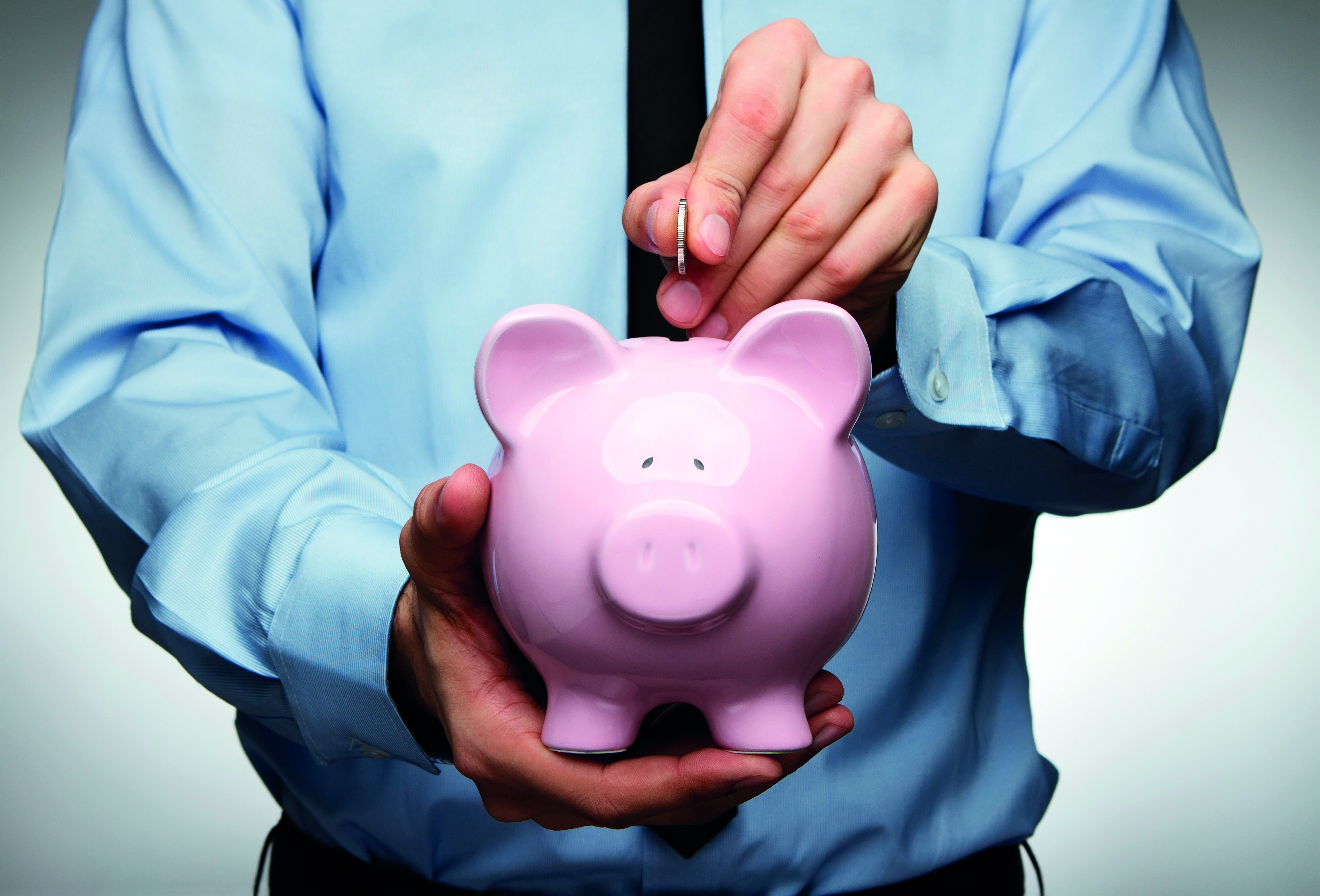 man holding a piggy bank