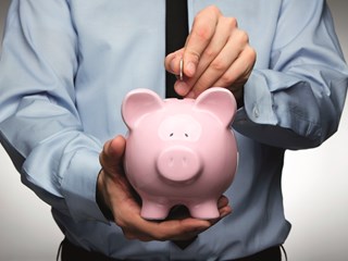 man holding a piggy bank