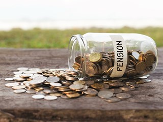 Pension jar tipped over spilling coins