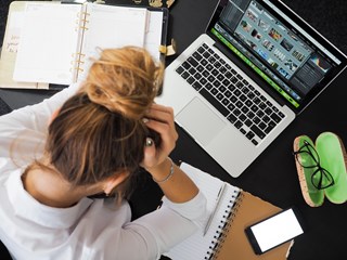 first time buyer running mortgage numbers on a laptop