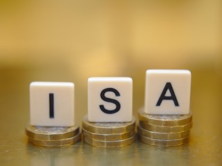 Letters spelling ISA on stacks of coins