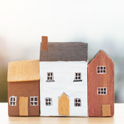 three miniature houses made from clay