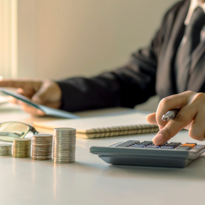 person working out finances on calculator