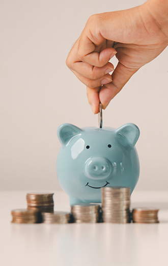 Piggy bank with coin stacks