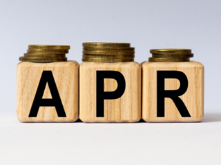 the word APR made from wooden blocks