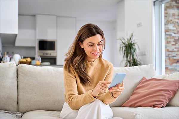 Woman browsing products on a phone.