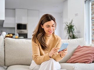 Woman browsing products on a phone.