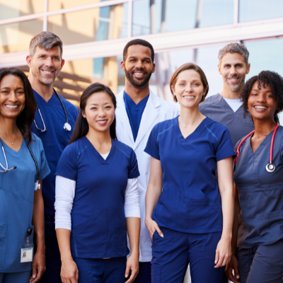 medical staff smiling outside a hospital