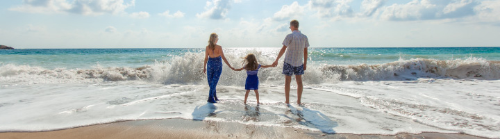 Family walking in the surf
