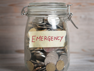 emergency fund jar full of coins