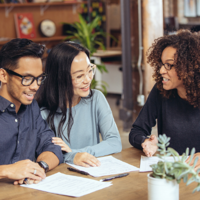 young couple having a discussion with a financial advisor