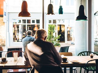elderly man in a cafe