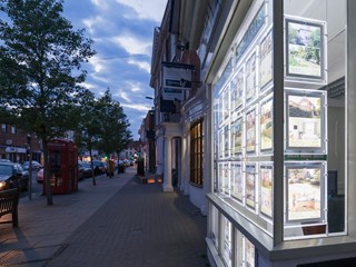 estate agents window at night