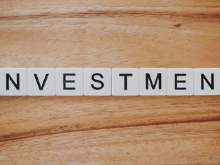 Investment spelt out on a table