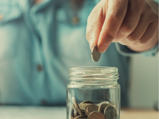 Putting savings into a jar 