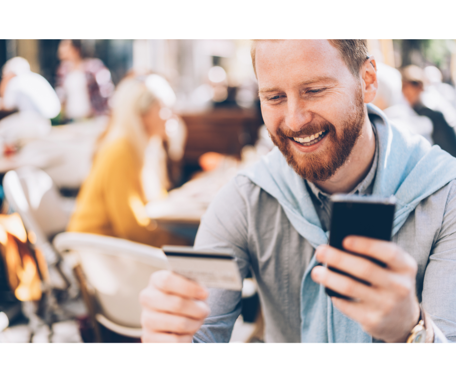 Person using credit card and phone