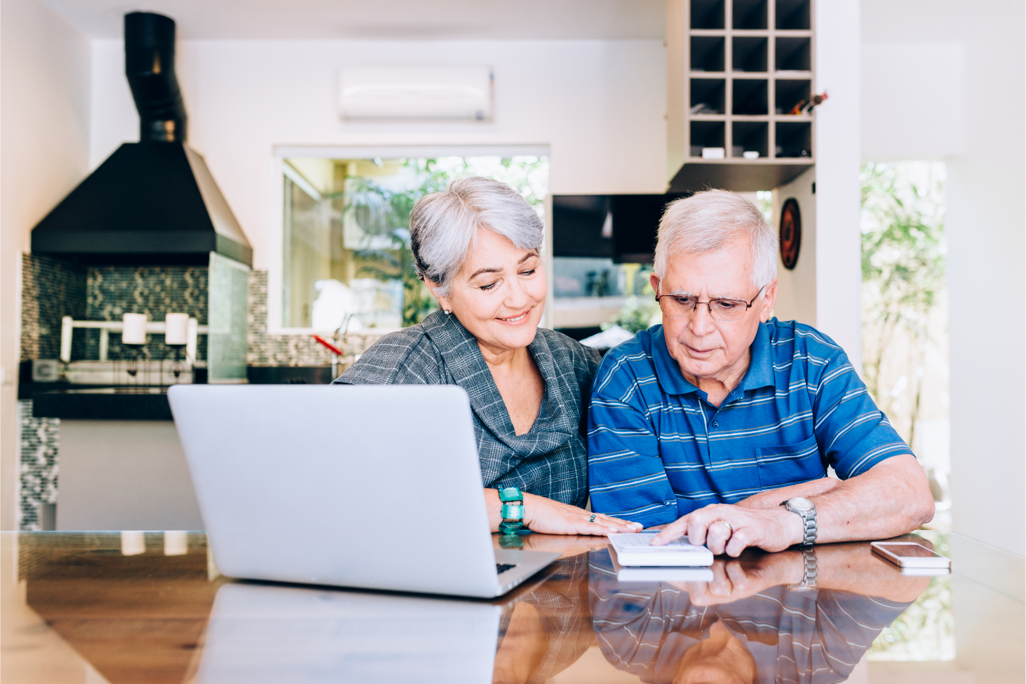 Elderly couple making calculations