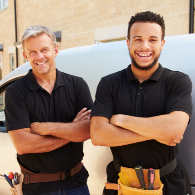 Trades people beside van