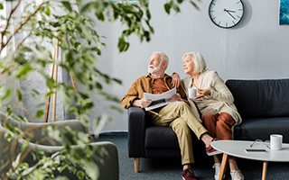 Couple sat on sofa