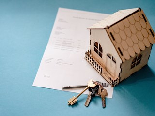 A small wooden house with keys