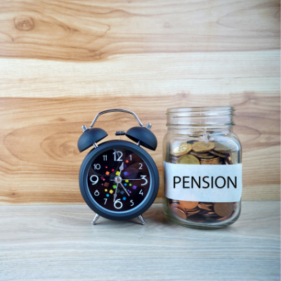 pension coin jar beside alarm clock