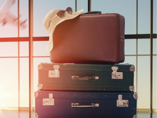 suitcases piled on top of eachother