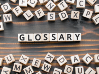 glossary spelt in scrabble tiles