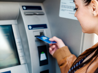 woman using an atm machine