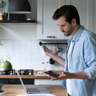 a person looking confused using a laptop