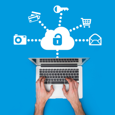 typing on a laptop with a security cloud over the top