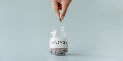 Coin dropped into jar